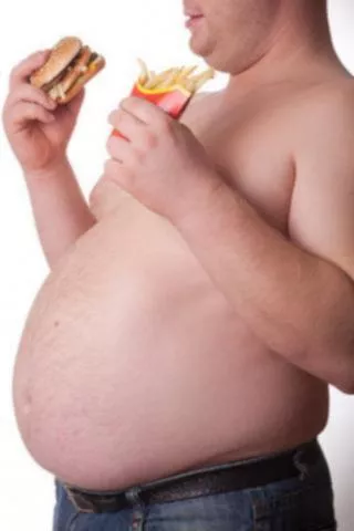Hombre obeso comiendo comida rápida Hombre obeso comiendo comida rápida